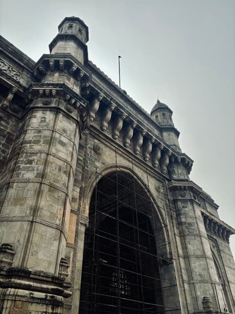 Gateway of India shot from below against the sky