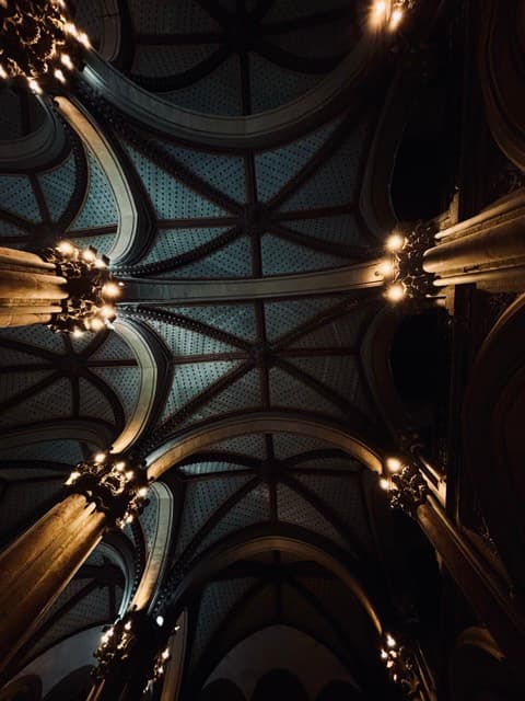 Gothic vaulted ceiling of CST with warm chandeliers